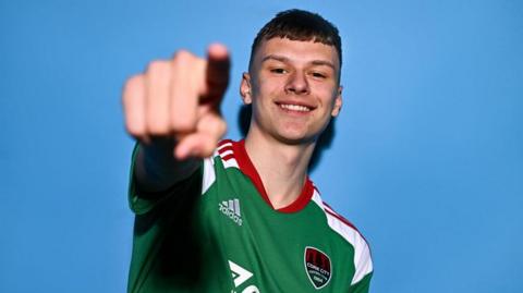 Joe O'Brien-Whitmarsh poses for a portrait during a Cork City squad portrait session