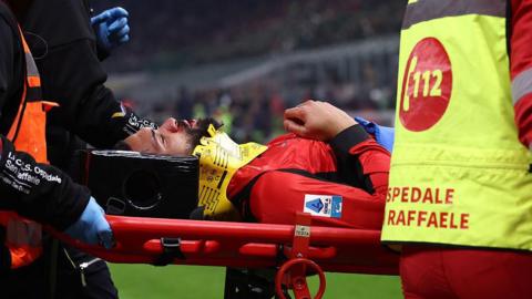Ruben Loftus-Cheek is carried off on a stretcher by medics