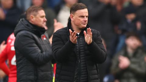 Richie Wellens claps his players after a match 