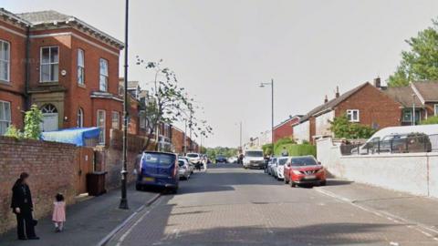 Google streetview of houses and cars on either side of Cardinal Street