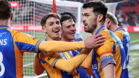 Shrewsbury goalscorer John Marquis celebrates with team-mates