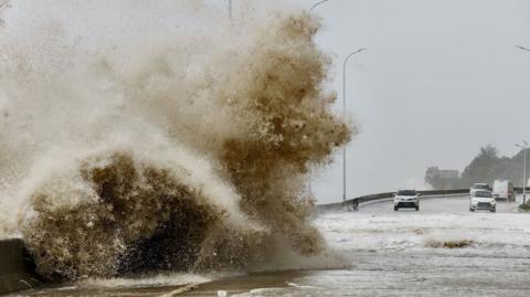 Waves crash on the coast of Sansha town as Typhoon Gaemi approaches, in Ningde, Fujian province, China