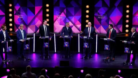 The leaders on stage during the debate