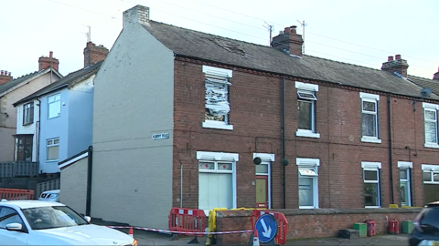 Safety barriers and tape around the house in Eston