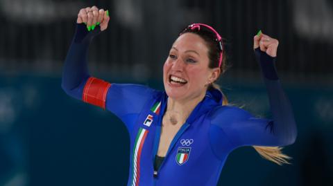 Italy's Francesca Lollobrigida celebrates winning speed skating gold