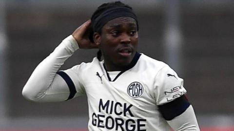 Abraham Odoh of Peterborough United looks on after scoring a goal