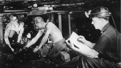 Photo showing Henry Moore sketching working coalminers at Wheldale Coliery in 1942