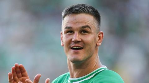 Johnny Sexton applauds the Irish fans after beating Romania