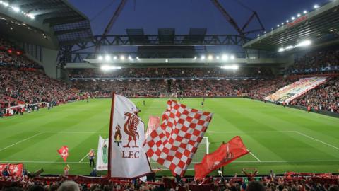 Liverpool fans flying flags on the Kop