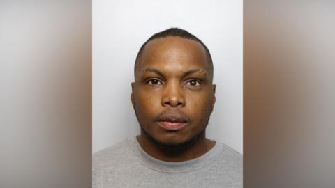 A police mugshot of Omarie Adams.