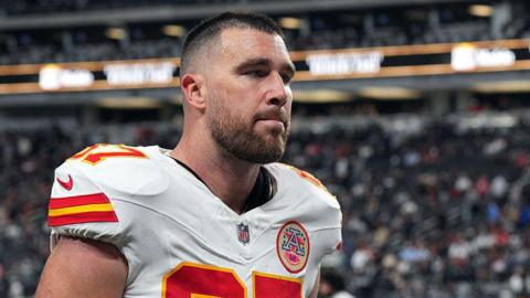 Travis Kelce walks off the pitch 