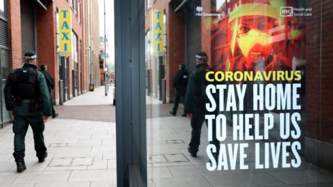 Undated handout photo issued by PSNI showing officers patrol Belfast city centre during the coronavirus lockdown