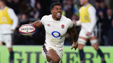 England wing Immanuel Feyi-Waboso celebrating with the ball in his right hand