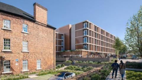 A CGI image of a five-storey building with corrugated wood cladding. A brick house is to the left. People, trees and parked cars can also be seen.