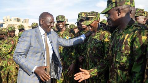 Kenya's President William Ruto greeting Kenyan police officers in Port-au-Prince, Haiti - 21 September 2024