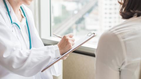 Doctor in consultation with a woman patient