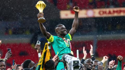Sadio Mane lifts the Afcon trophy