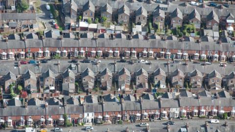 An aerial view of several streets of terraced housing in York city centre.
