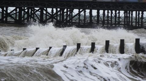 Waves crashing down in the seat at Hastings on the south coast of England