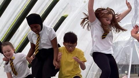 Children jumping in a playground