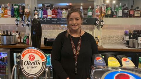 Megan O'Loughlin behind the bar at the Cat With No Tail