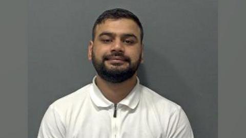 Naqash Ali in his mugshot