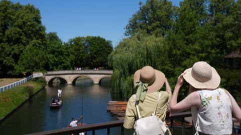 Women looking at river Cam in Cambridge