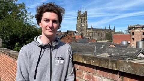 Sam Fallen Nutt with a view overlooking St Mary's Church in Stockport