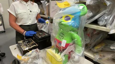 Haul of goods including large figurine and watches.