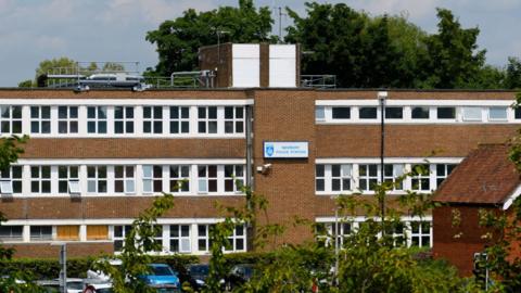 A general view picture of Newbury police station in 2020, a three-storey building with a plaque that says "Newbury police station" on it.
