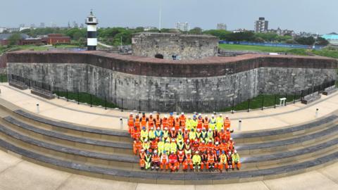 Team at the Southsea Coastal Scheme celebrate finishing the promenade around Southsea Castle