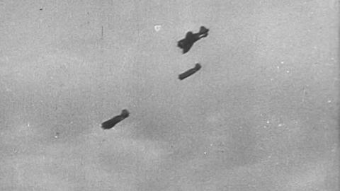 A black and white image of planes flying in the 1940s