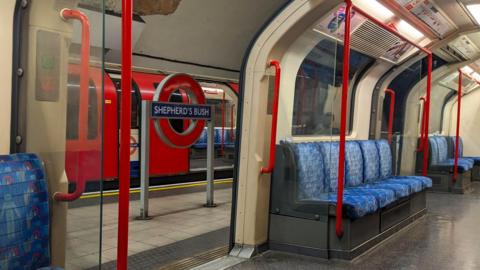 View of an empty Central carriage at Shepherd's Bush Underground Station