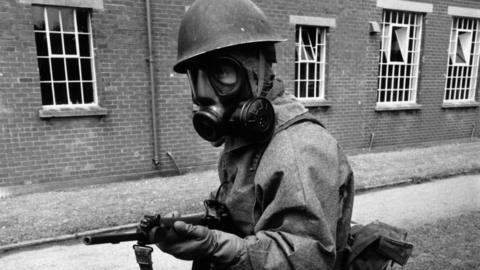 1964: A soldier in an anti-microbe suit at Porton Down, Wiltshire