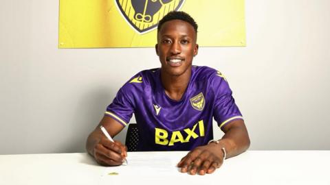 New Oxford United signing Siriki Dembele poses after signing his contract with the U's.