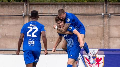 Penybont midfielder Gabe Kircough celebrates with his teammates