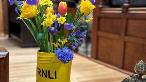 RNLI boot with flowers in it