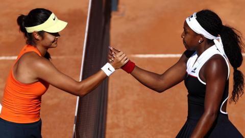 Emma Raducanu and Coco Gauff shake hands at the net after their Italian Open match