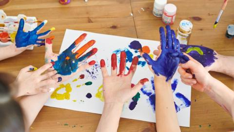 Children's painted hands