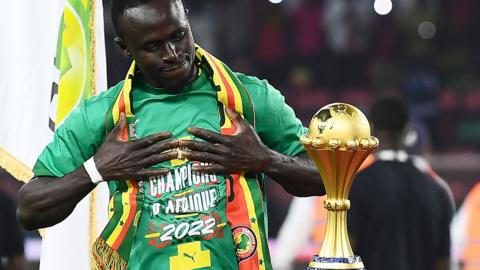 Sadio Mane with the Africa Cup of Nations trophy