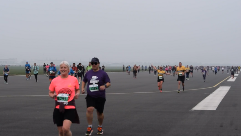 Hundreds of people running on the runway at Doncaster Sheffield Airport.