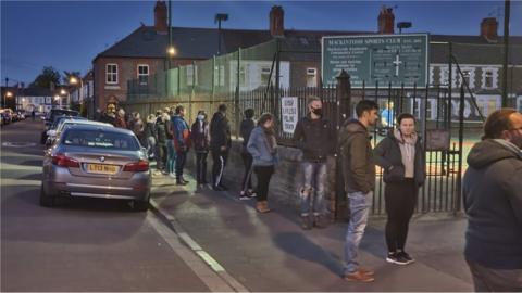 People queuing outside a polling station in Cardiff