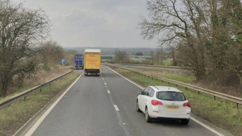 A generic image of the A45 in Ryton. There is a white car and a DHL truck. 