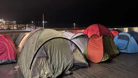 Tents lined up near Brighton beach