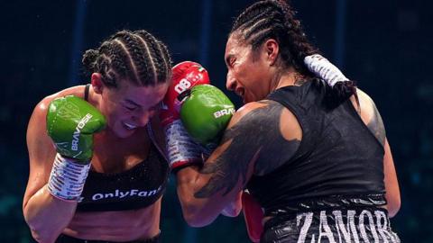 Sandy Ryan and Karla Ramos Zamora punch each other