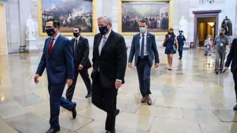 Mark Meadows and Steven Mnuchin walking into Congress