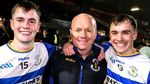 Ruairi Canavan and Darragh Canavan celebrate Errigal Ciaran's success with their father Peter (centre)