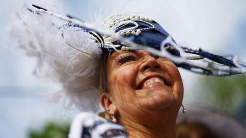 Woman in a hat at Aintree Ladies Day 2024