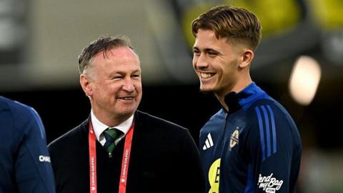 NI manager Michael O'Neill with Isaac Price