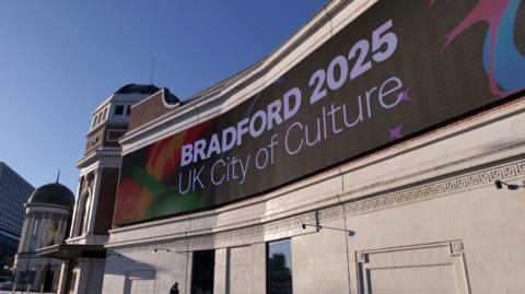 The facade of Bradford Live with the words Bradford UK City of Culture 2025 on an illuminated sign across the facade of the building